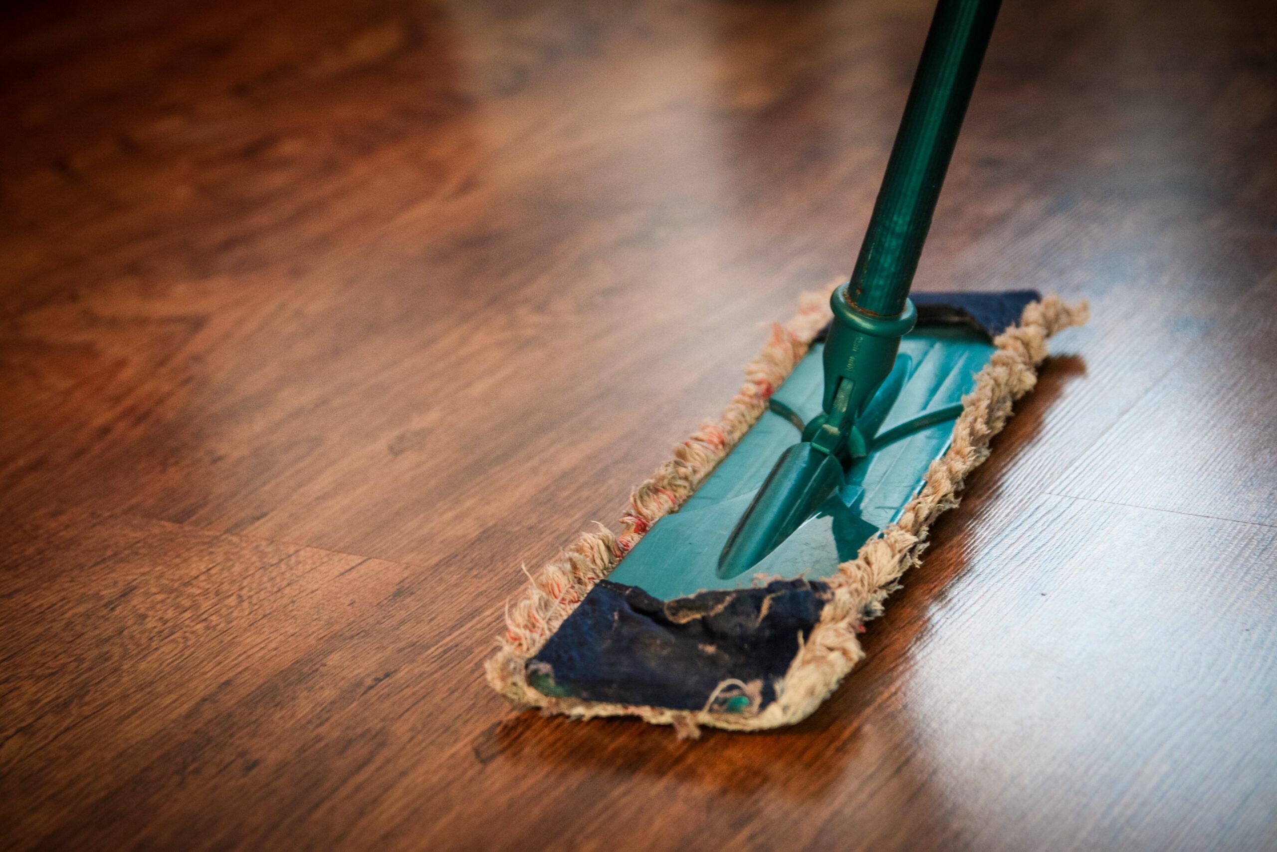 A mop on a hardwood floor.